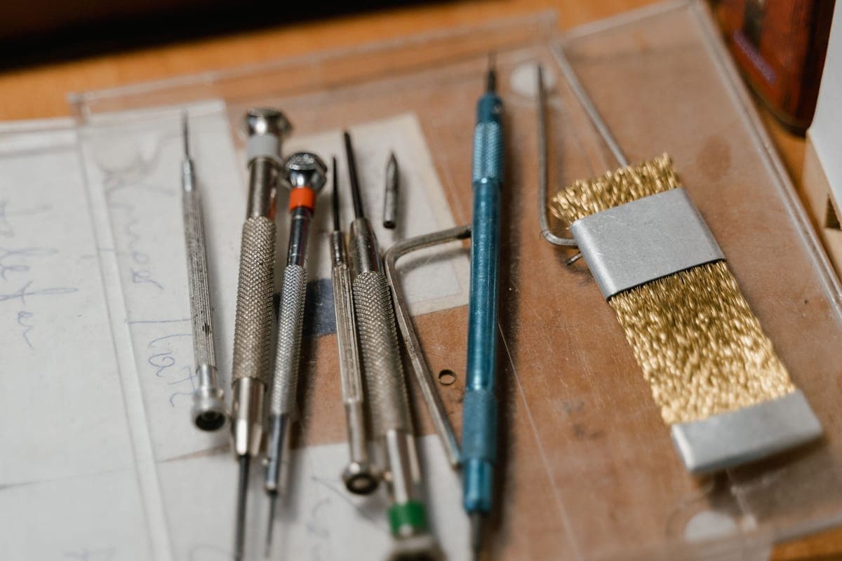 Detailing brushes of different sizes arranged on a workbench
