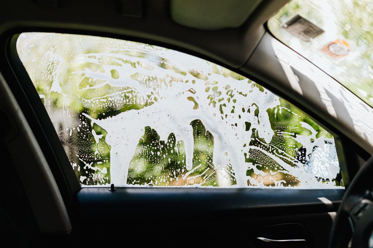 A soapy car window seen from inside the car