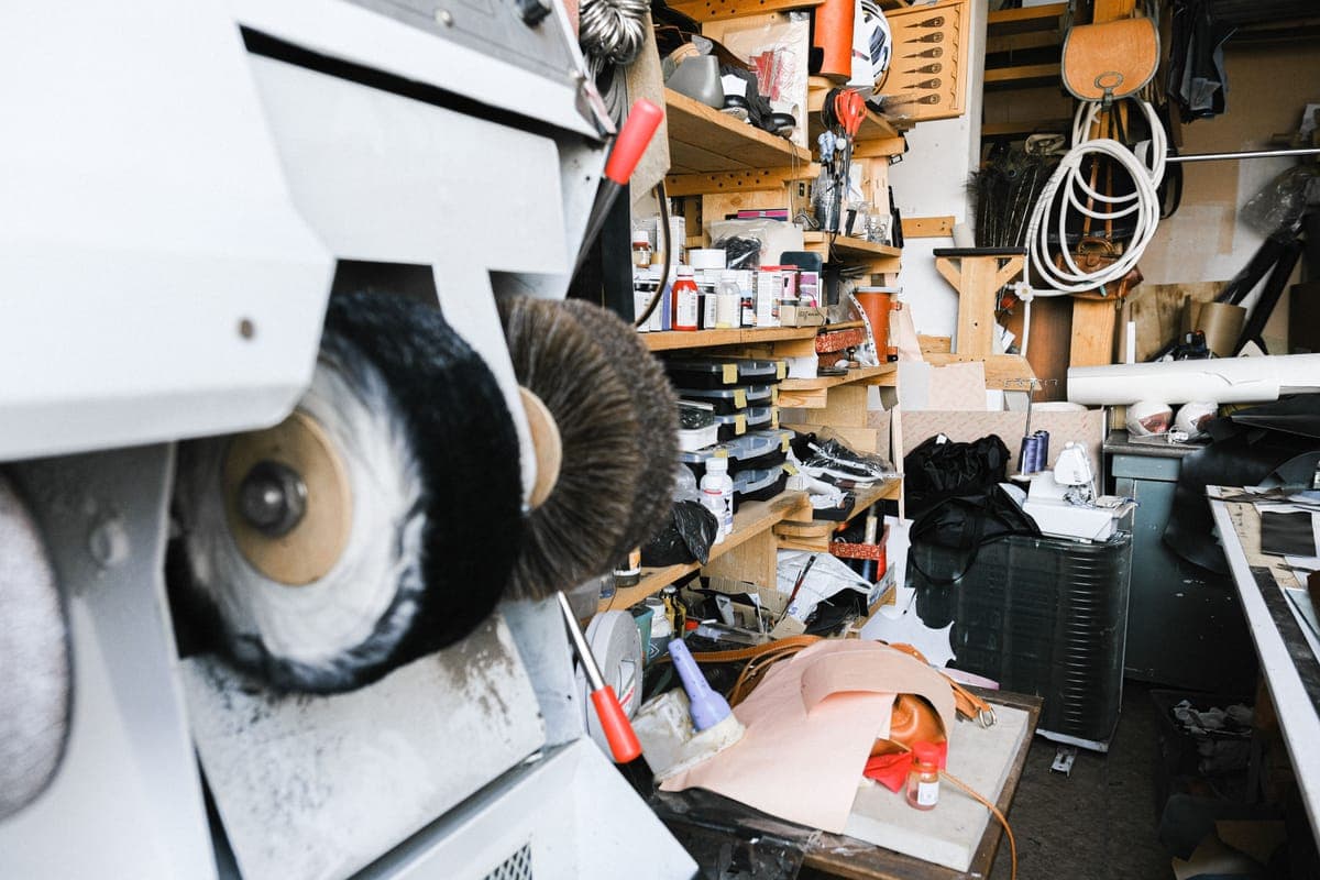 Two compact dual action polishers resting on a clean workbench