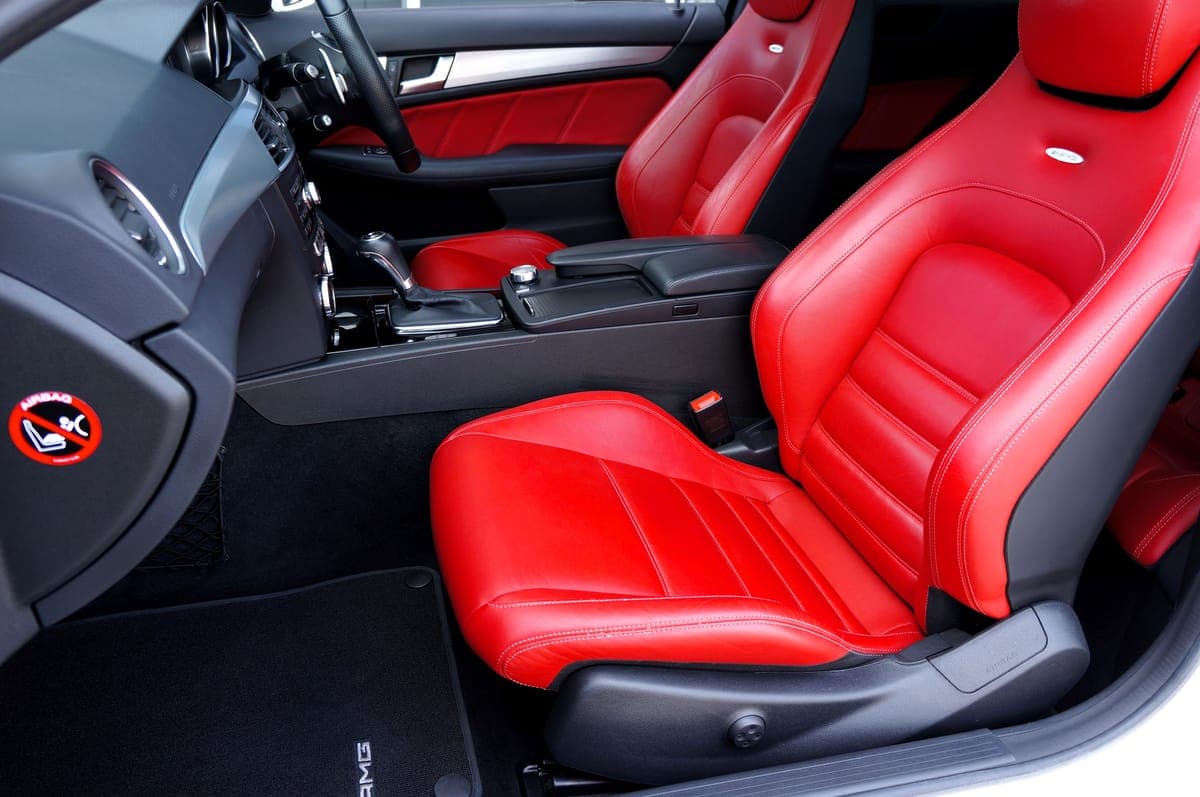 A red leather car seat and its side bolster