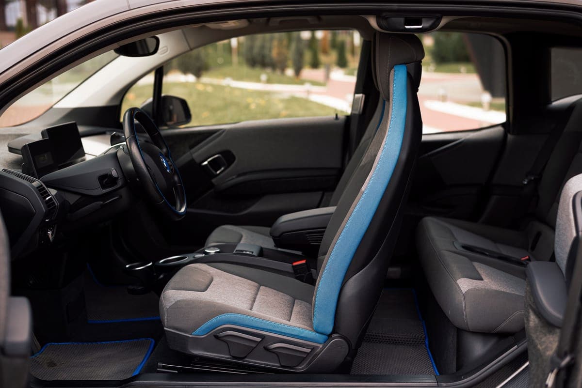Fabric car seats seen through an open door