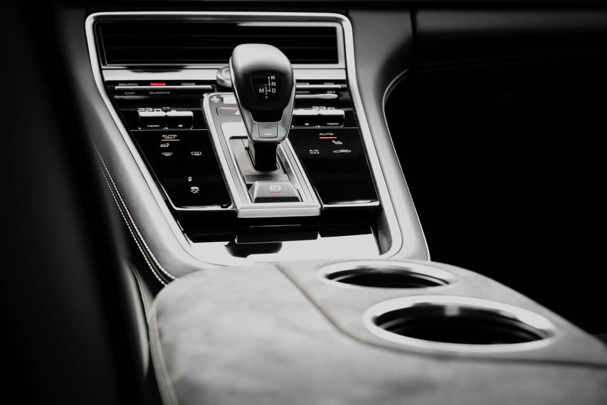 Glossy black interior trim around a car center console