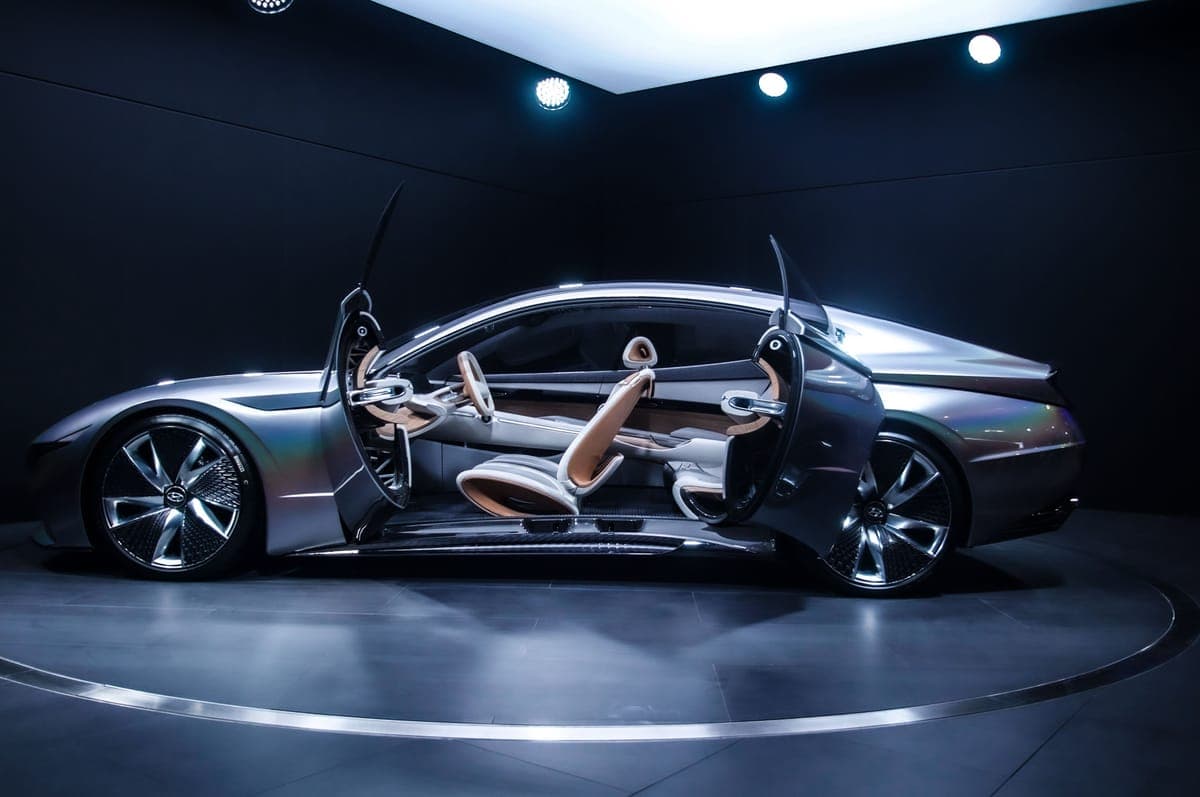 A car displayed indoors with its doors open