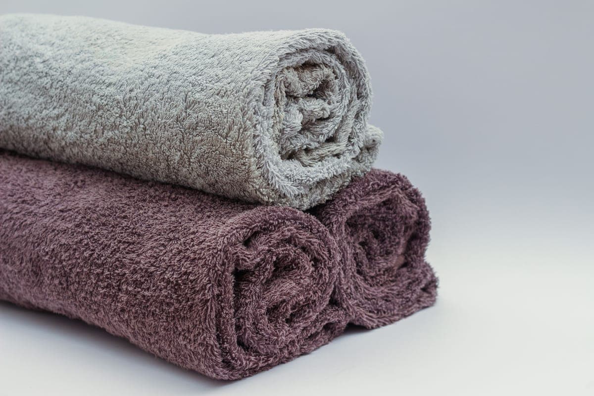Microfiber towels of different thicknesses stacked and compared